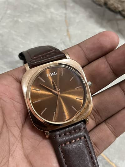 TOMI new article brown colour sleek dial