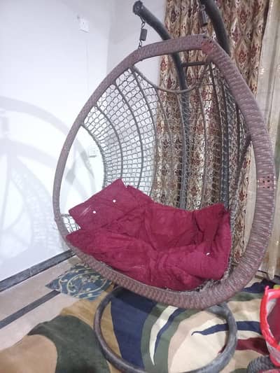 Elegant Hanging Egg Chair with Plush Maroon Cushion