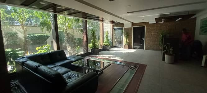 1000 sq yards bunglow near shahrah e faisal with huge car parking for commercial use huge Halls inside