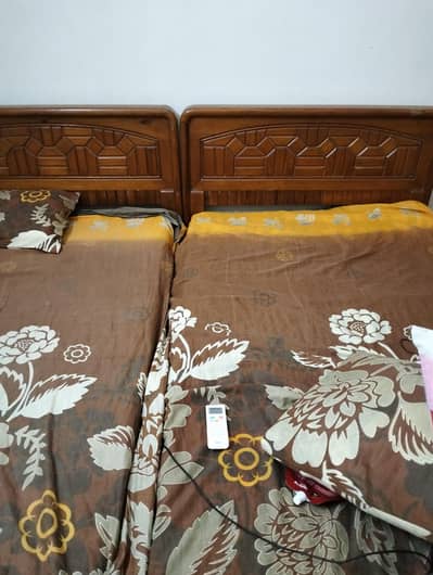 Wooden 2 single beds