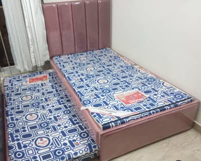 A bunk bed with sliding drawer