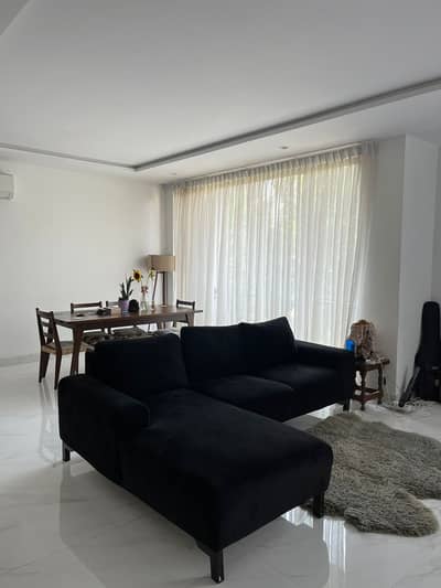 Black L shaped sofa (Velvet poshish)