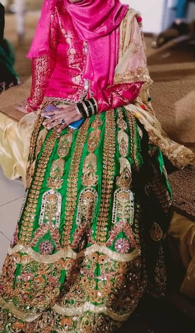 mehendi lehenga with medium sized choli and embroidered net dupatta