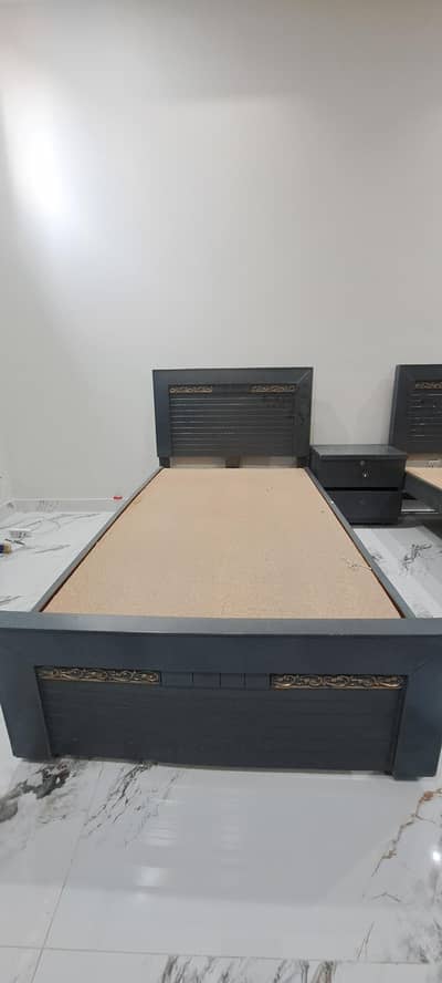 single beds with side table