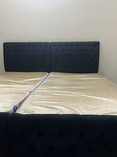 2 velvet back wooden beds with mattress