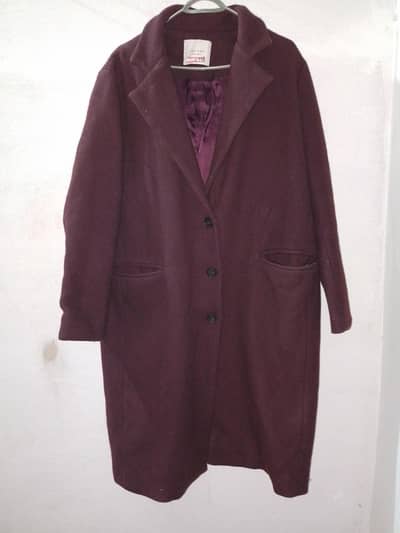 Maroon long coat for women .
