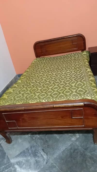 Single Used wooden bed