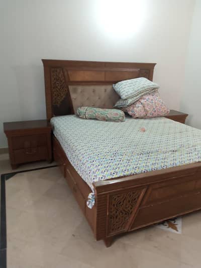 king size bed with two side table