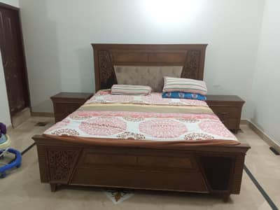 king size bed with two side table