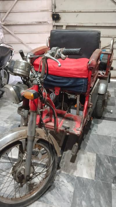 Three wheel motor cycle for  disable people