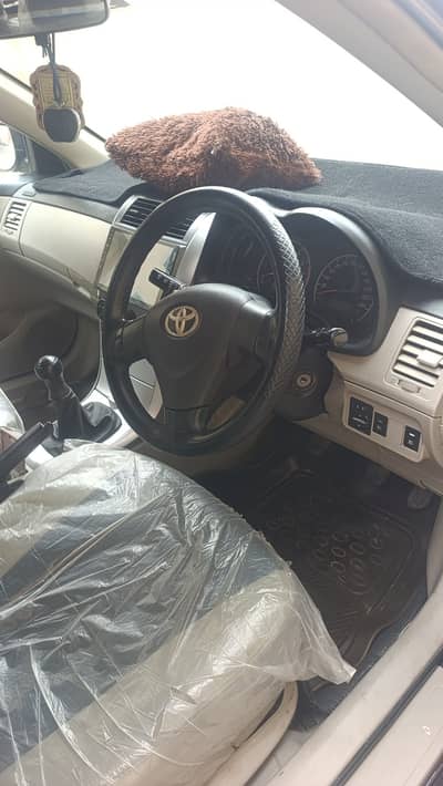 Toyotta Carrolla. 2012 model GLI