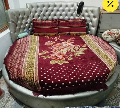 circle bed with 2 side table and round sofa.