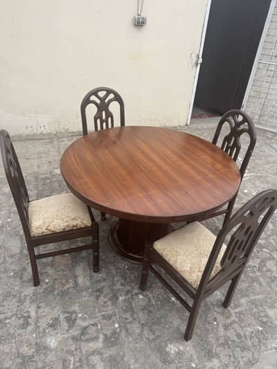 Elegant wooden round dining table with 4 cushioned chairs
