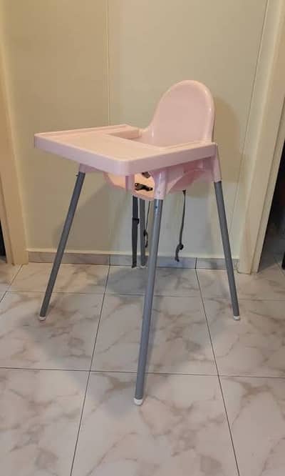 Ikea high chair in pink with seat cover