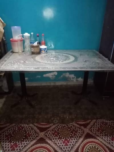 Dining table glass top along with six chairs