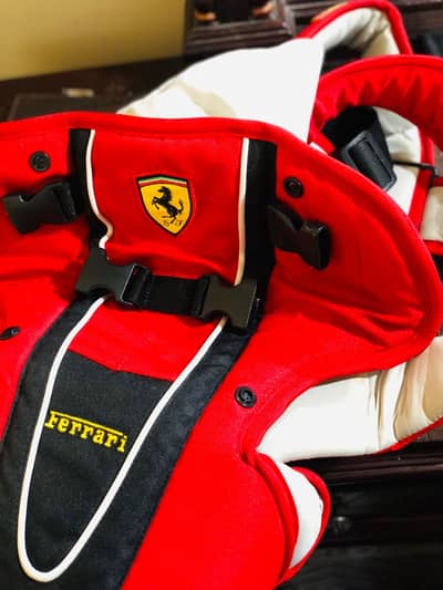 Baby carrier with ferrari logo