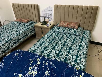 2 single cushioned beds for sale