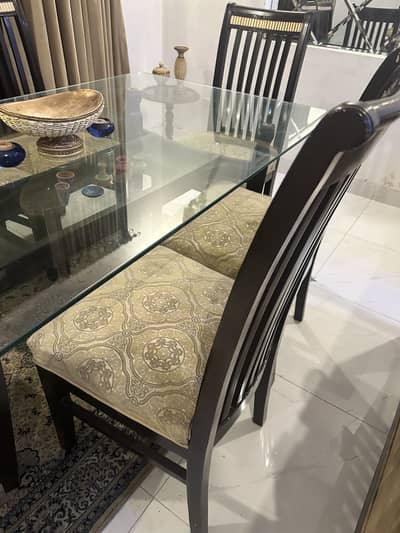 Glass top Dining table with 6 chairs for urgent sale