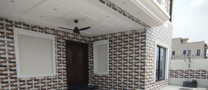 A Masterpiece Of Material & Design Modern 10 Marla Home With Two Company Kitchens & Premium Flooring In DHA Phase 5