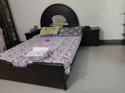 wooden solid bed with side tables and dressing table