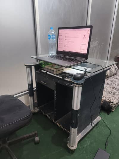 2 Office tables and one rolling chair.