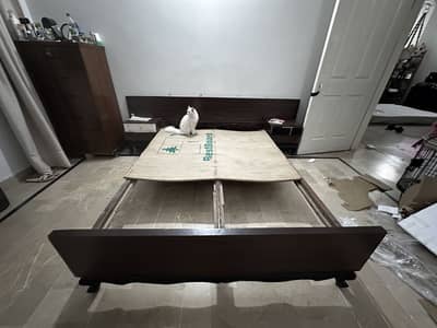 Used bed with side table
