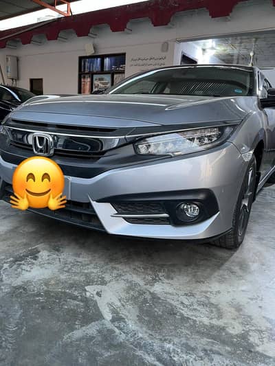 Honda civic  2021 model  side mai thora color hai baqi genuine hai