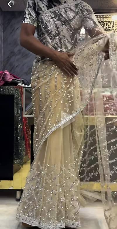 Indian pearls net saree peach colour