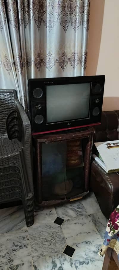 LG coloured television with Tv trolly
