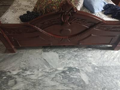 bed with side tables and dressing table