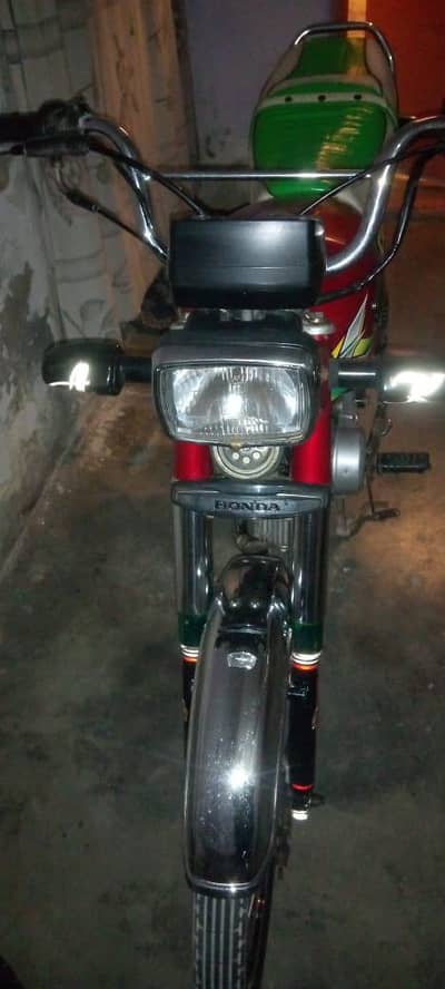 Red color Honda 70 23 model Karachi registration he