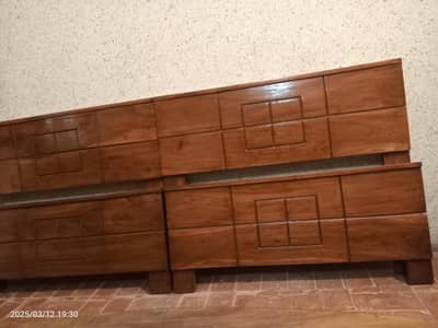 2 wooden single beds