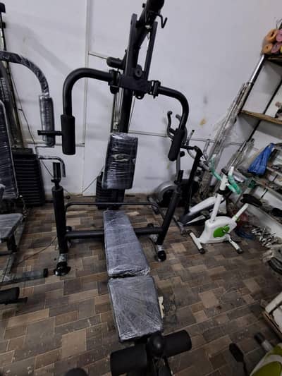 Exerciser home gym with foldable bench