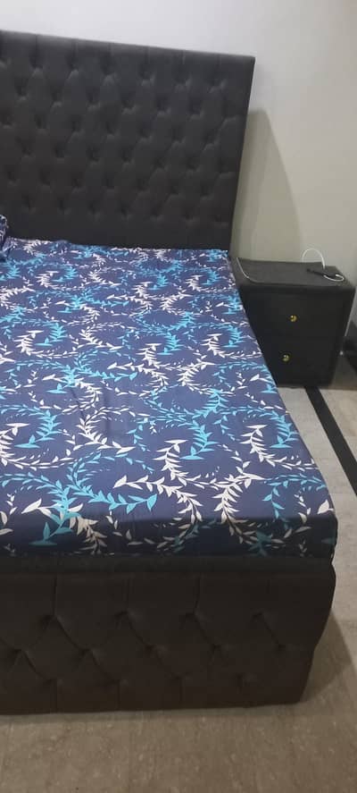 double bed with side table and dressing
