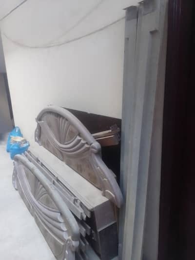 one bed with mattress 2 sid table . dressing ND divider.