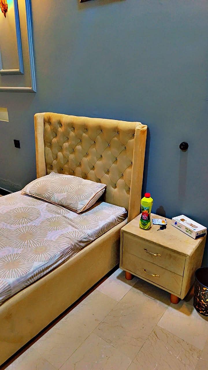 single bed with side table and metres 1