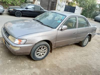 Toyota Corolla Indus  2000 0/3/0/4/3/0/3/1/4/6/8 urgent sale