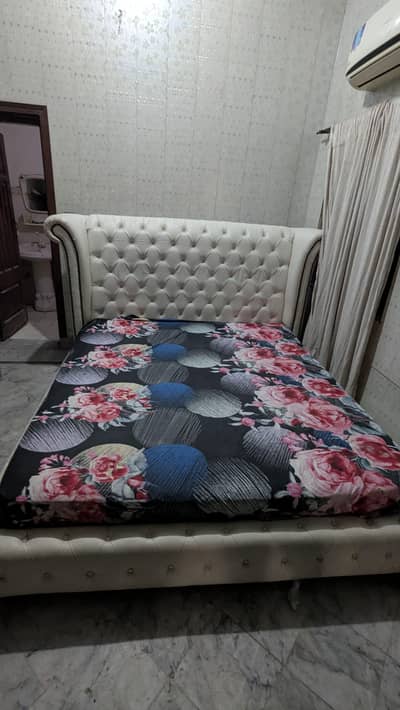 bed with leather covered