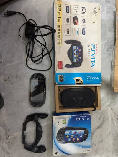 PS vita with one game box charger gaming handel battry dead