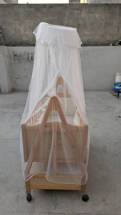 Swinging baby cot with  anti mosquito net