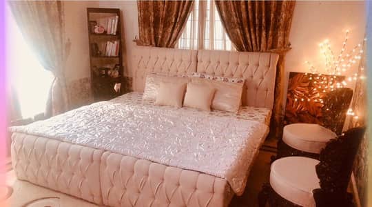 Two single beds without mattresses.