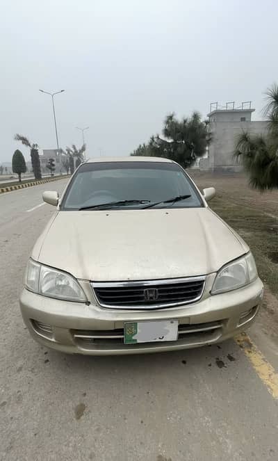 Honda city 1999 facelifted into 2002