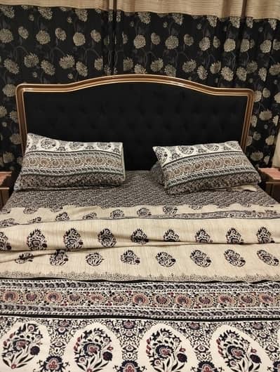 bed with dressing and side tables