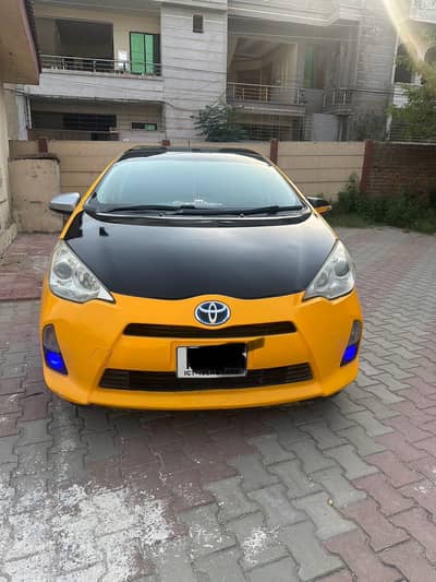 Toyota Aqua 2013 – Yellow | Hybrid | Well Maintained