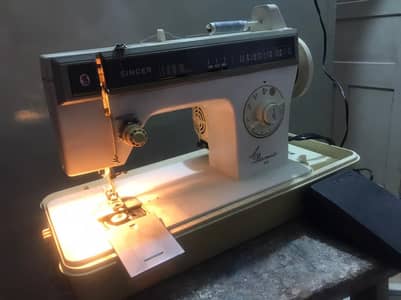 Japani sewing machine with catlags