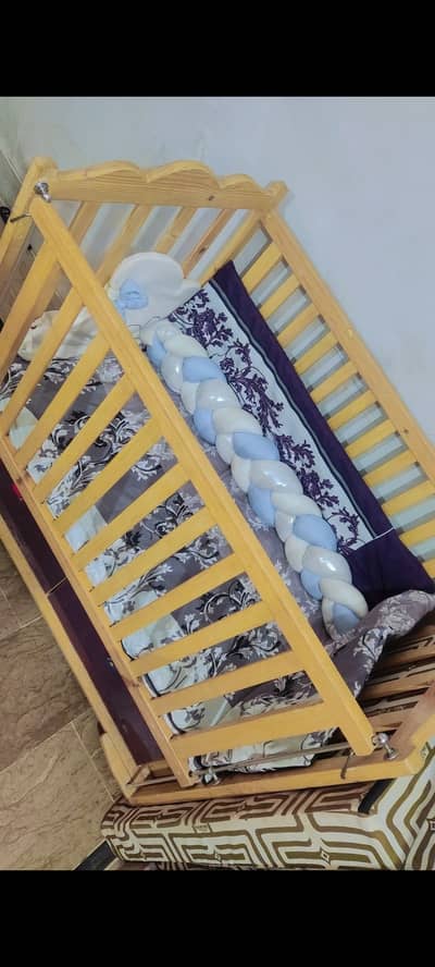 Baby cot with bumper and net