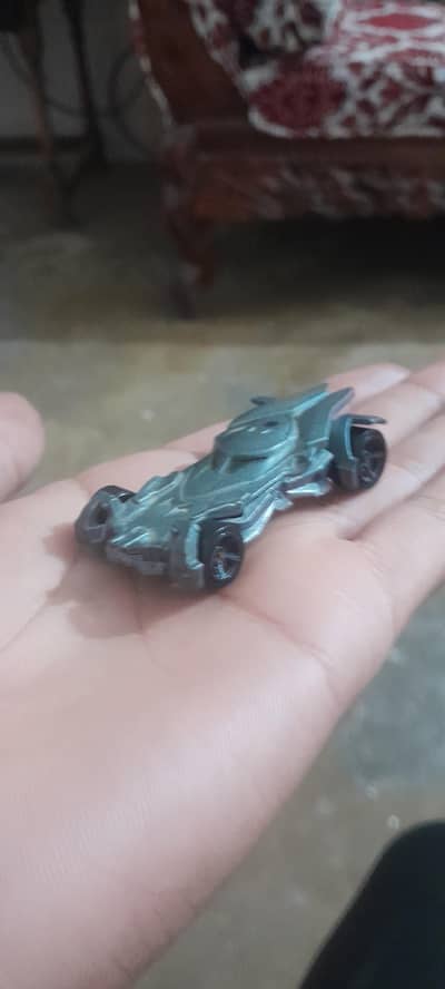 It is a toy hot wheel car
