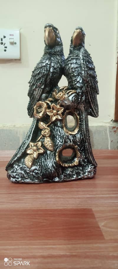 antique parrot sculpture