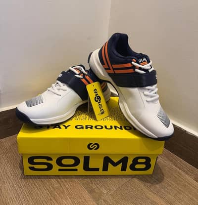 solm8 white orange and blue cricket shoes branded.