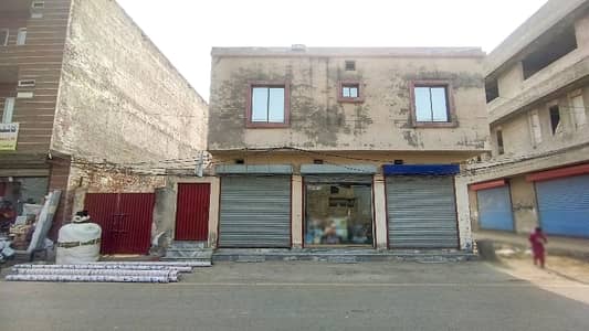 1 Kanal 3 Side Road Commercial Plot With Three Shops And Apartment Already Rented